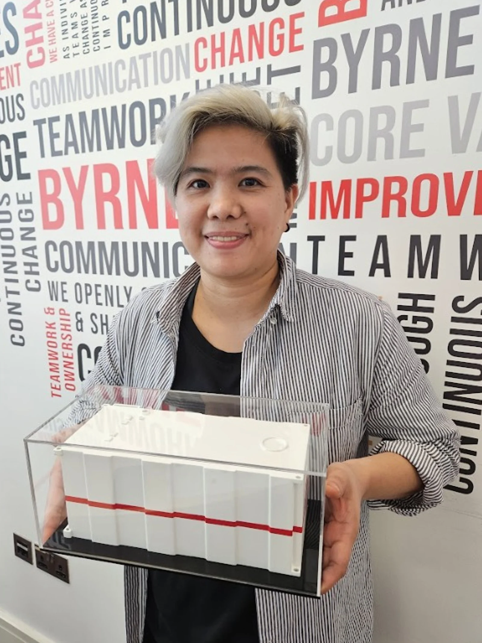 Client holding scaled model